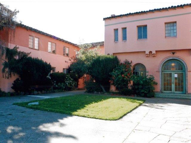 Before: Close up view of the grassy courtyard, offices and school.